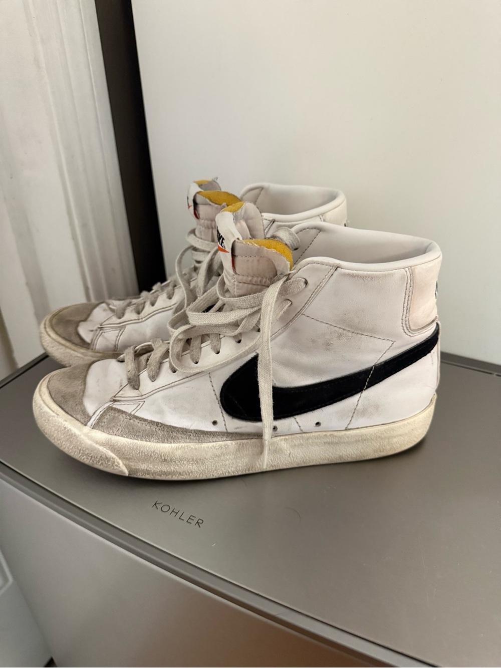 Nike White High-Top Sneakers and Yellow Tongue Detail